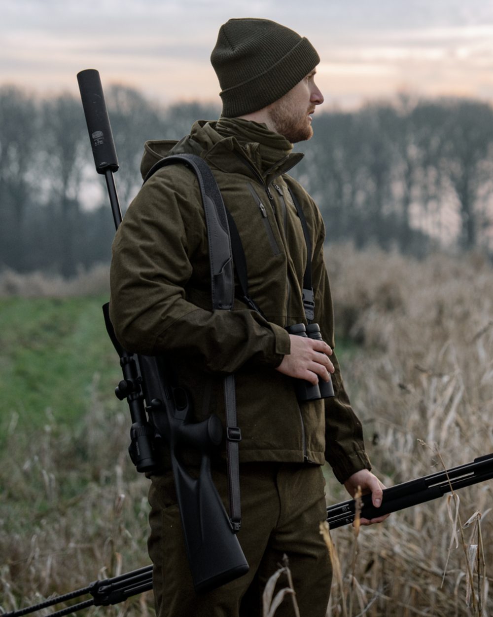 Pine Green Melange coloured Seeland Mens Quest Jacket on forest background 