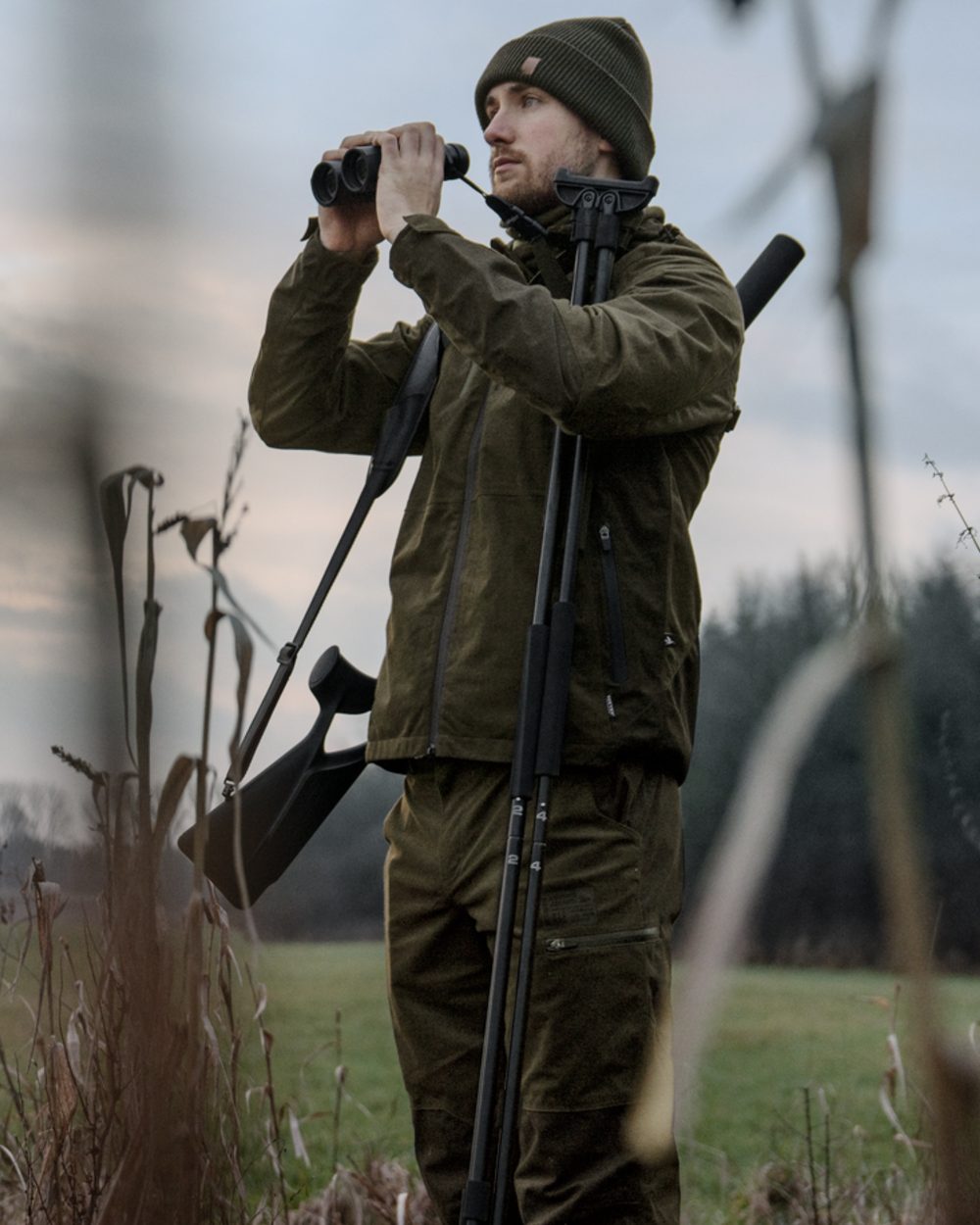 Pine Green Melange coloured Seeland Mens Quest Jacket on forest background 