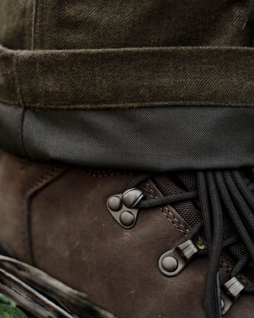 Pine Green Melange coloured Seeland Mens Quest Trousers on forest background 