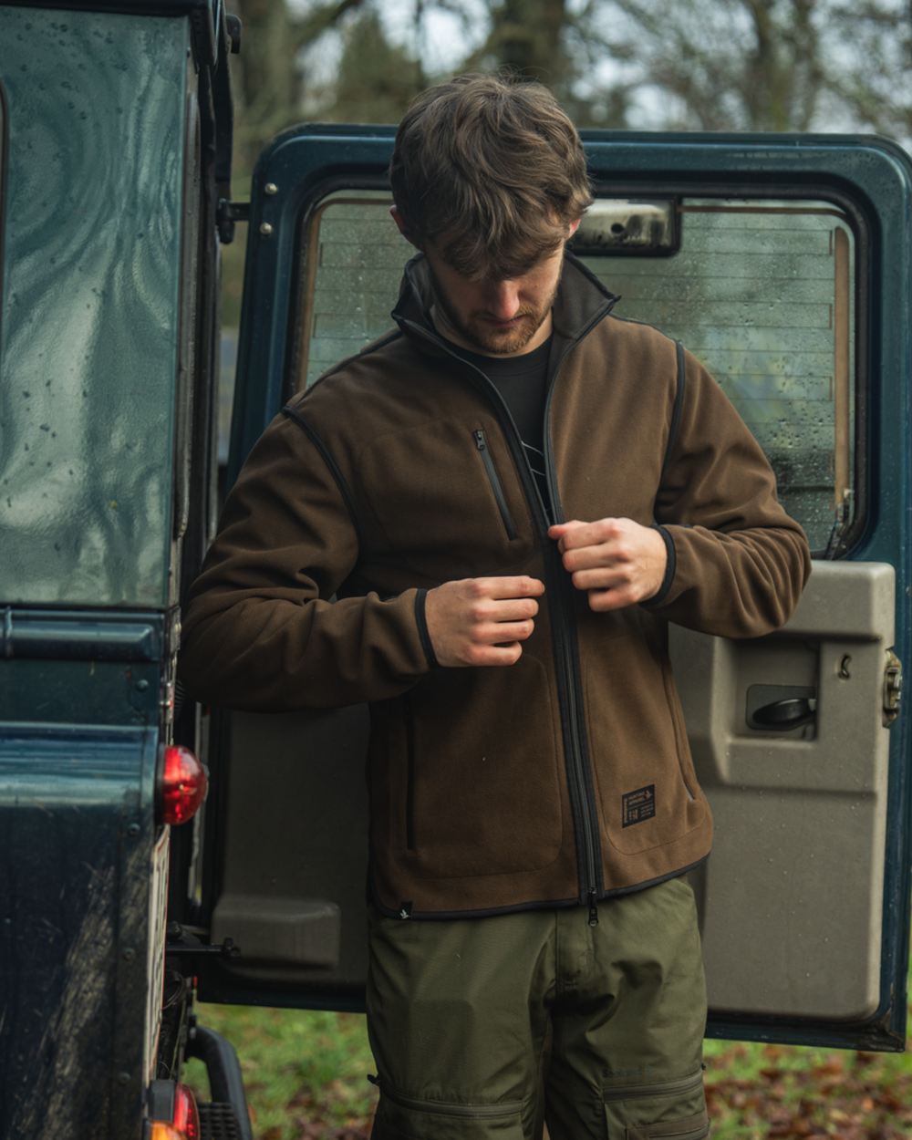 Grizzly Brown Demitasse Brown Coloured Seeland Mens Rogue Solid Reversible Fleece Jacket on forest background 