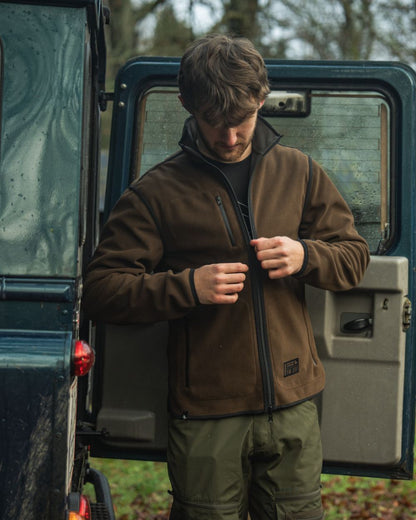 Grizzly Brown Demitasse Brown Coloured Seeland Mens Rogue Solid Reversible Fleece Jacket on forest background 