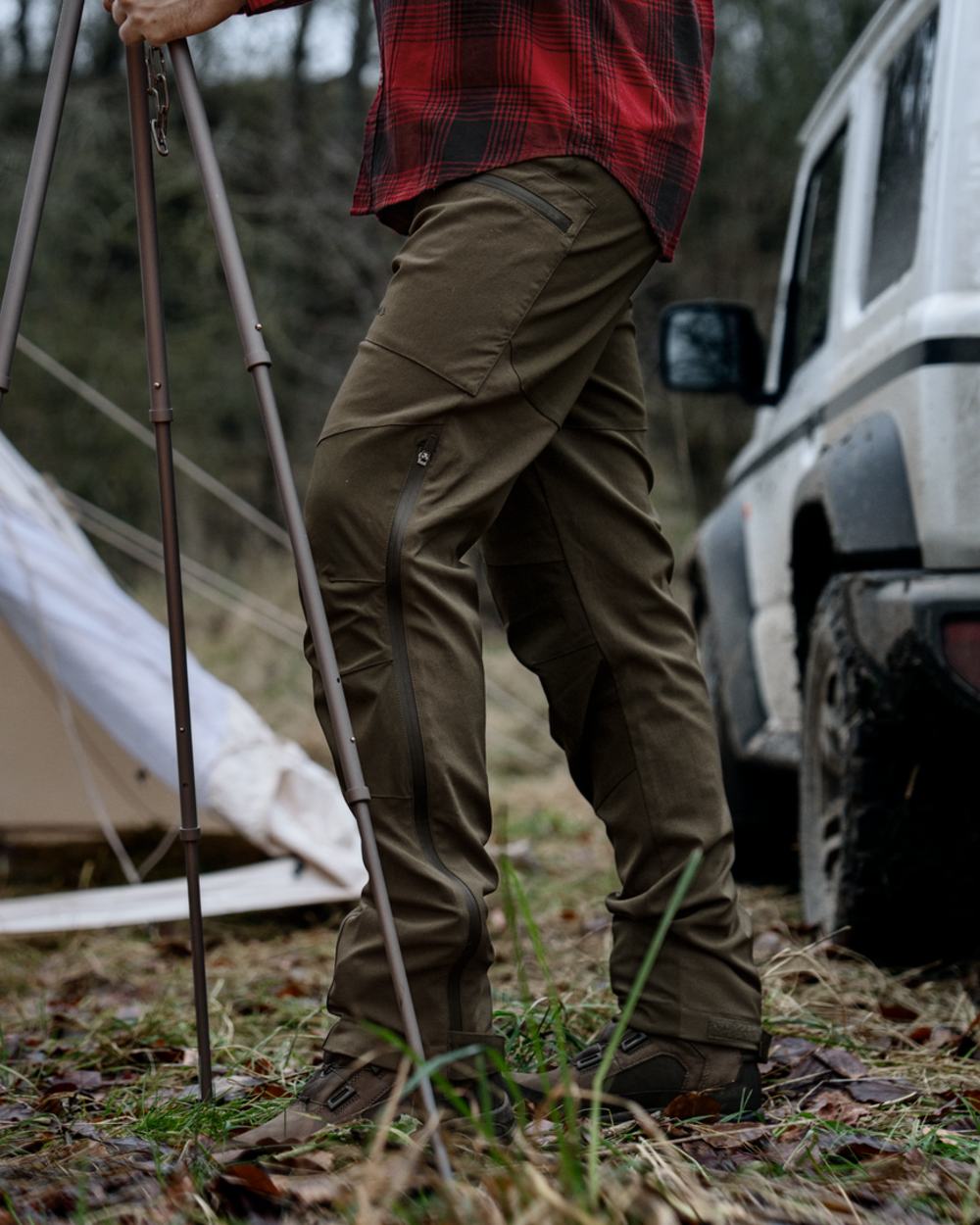 Pine Green Grizzly Brown coloured Seeland Mens Spruce Membrane Trousers on forest background 