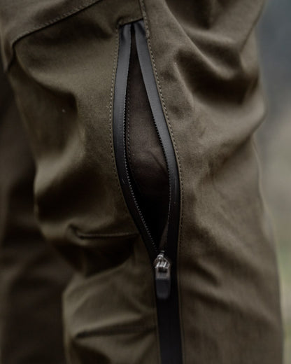 Pine Green Grizzly Brown coloured Seeland Mens Spruce Membrane Trousers on forest background 