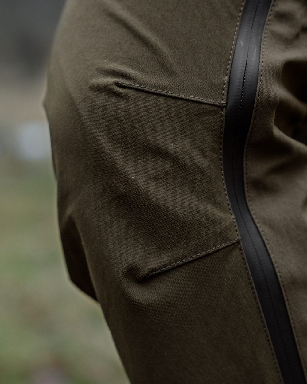 Pine Green Grizzly Brown coloured Seeland Mens Spruce Membrane Trousers on forest background 