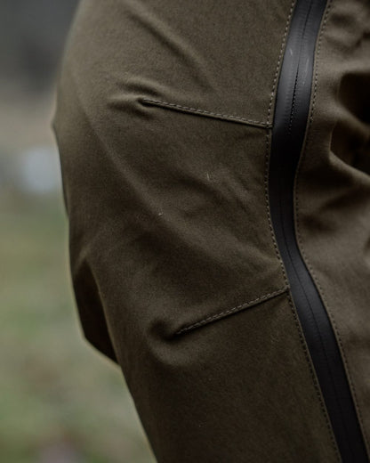 Pine Green Grizzly Brown coloured Seeland Mens Spruce Membrane Trousers on forest background 