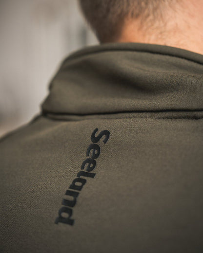 Pine Green Coloured Seeland Tidal Fleece Jacket on Indoor Background
