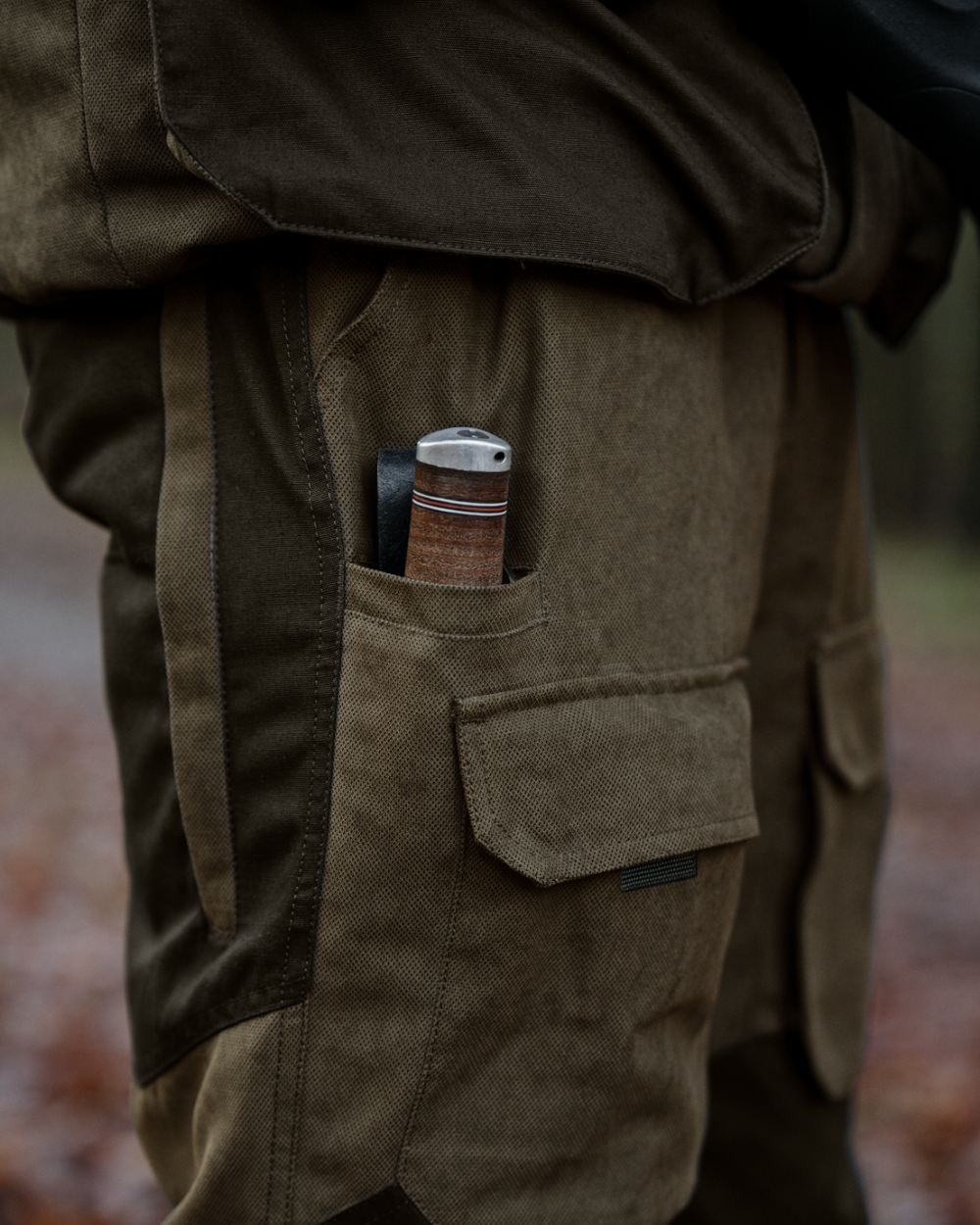 Grizzly Brown coloured Seeland Mens Ultimo Trousers on forest background 