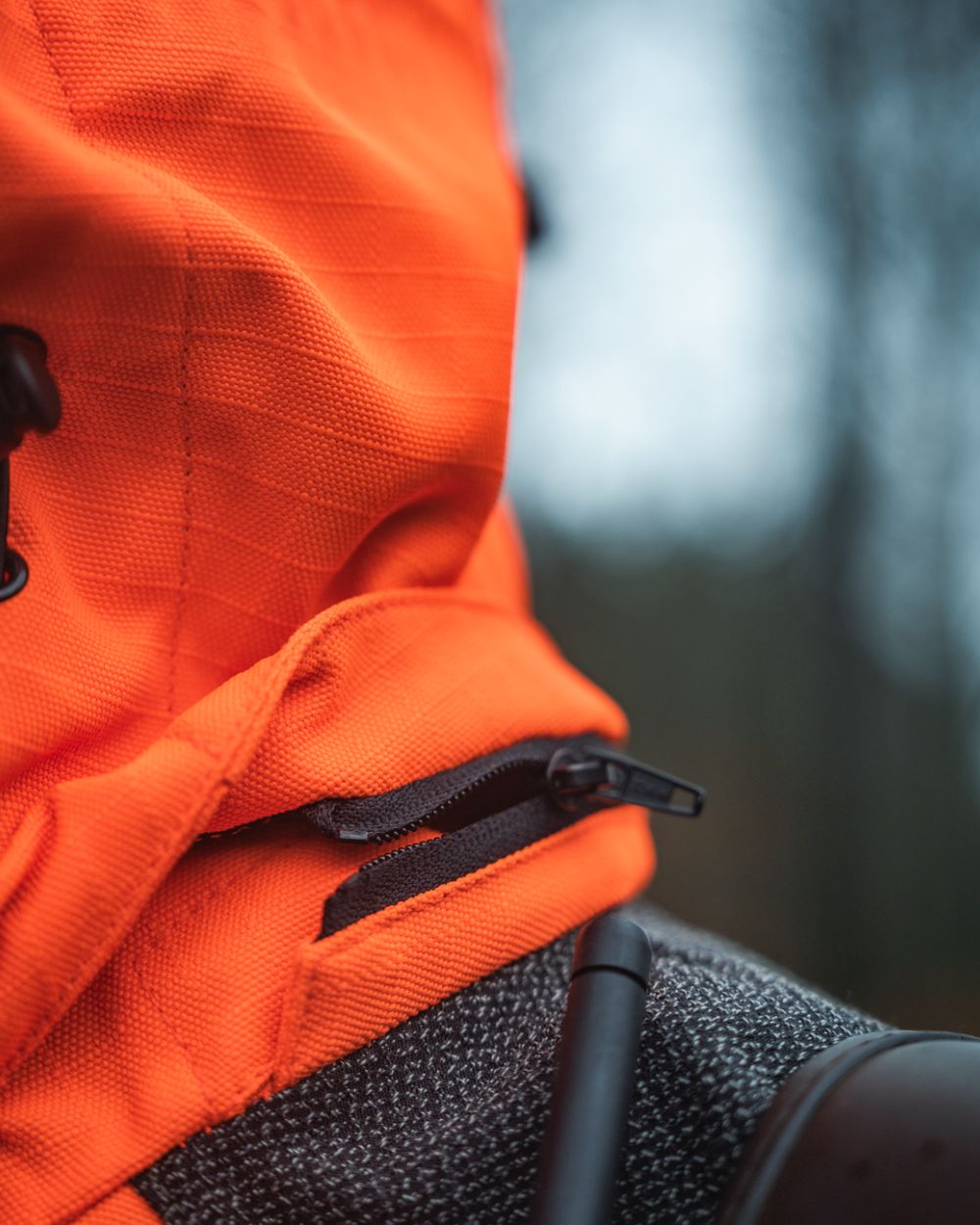 Orange Blaze Coloured Seeland Mens Venture Serac Jacket on outdoor background 