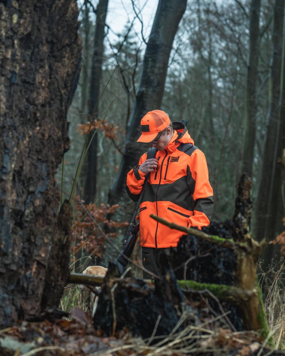 Orange Blaze Coloured Seeland Mens Venture Serac Jacket on outdoor background 