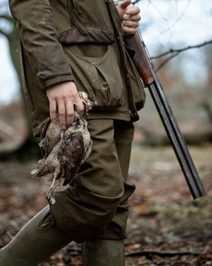 Shaded Olive coloured Seeland Mens Woodcock Royale Breeks on forest background 