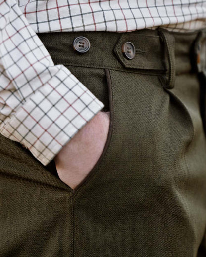 Shaded Olive coloured Seeland Mens Woodcock Royale Trousers on forest background 