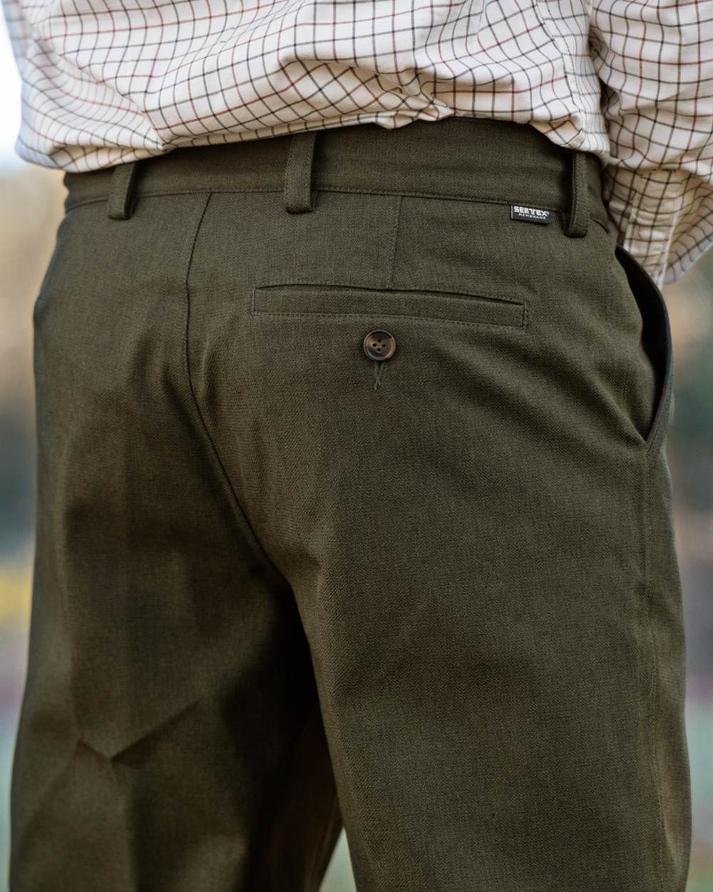 Shaded Olive coloured Seeland Mens Woodcock Royale Trousers on forest background 