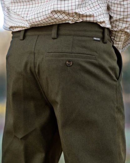 Shaded Olive coloured Seeland Mens Woodcock Royale Trousers on forest background 