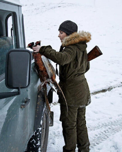 Pine Green coloured Seeland North Lady Jacket on snow backround 