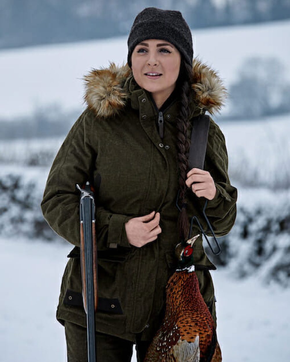 Pine Green coloured Seeland North Lady Jacket on snow backround 