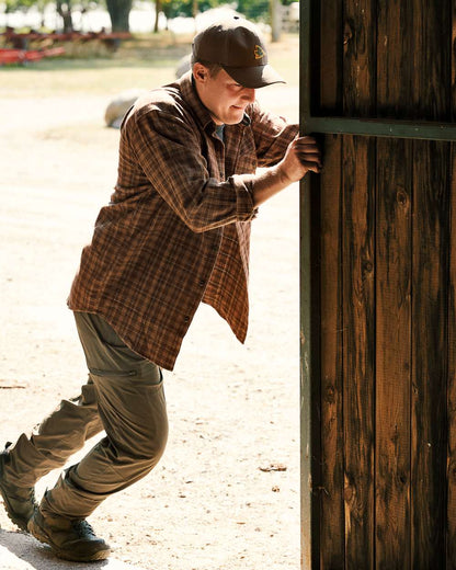 Pine Green Coloured Seeland Outdoor Stretch Trousers on outdoor background 