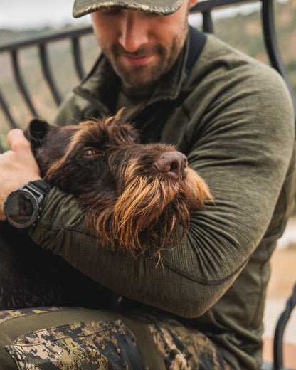 Pine Green Melange Coloured Seeland Peak Half Zip on outdoor background 