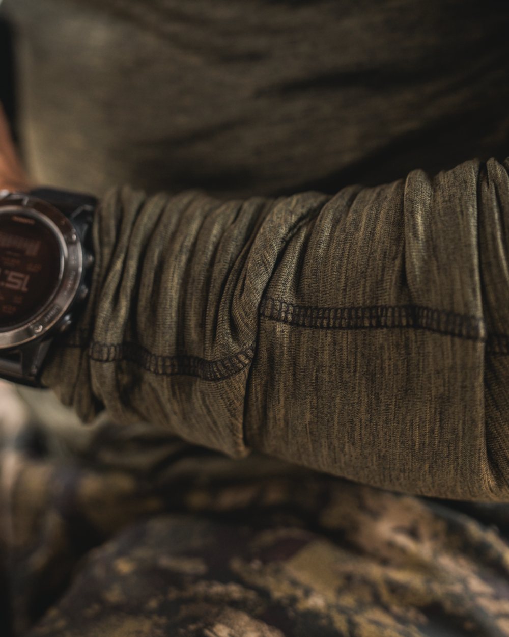 Pine Green Melange Coloured Seeland Peak Half Zip on outdoor background 