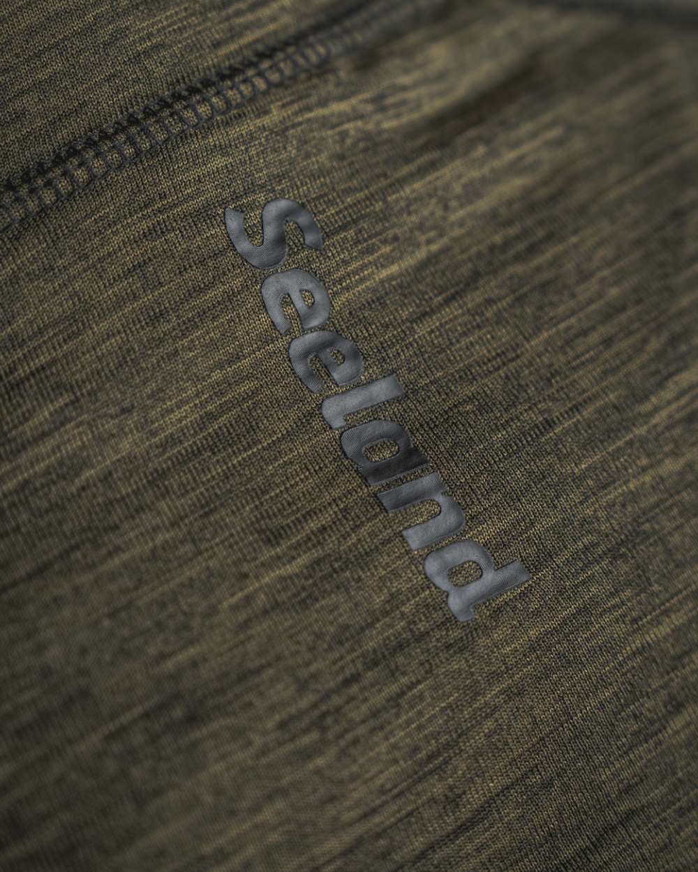 Pine Green Melange Coloured Seeland Peak Half Zip on outdoor background 