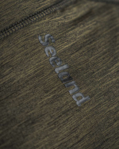 Pine Green Melange Coloured Seeland Peak Half Zip on outdoor background 