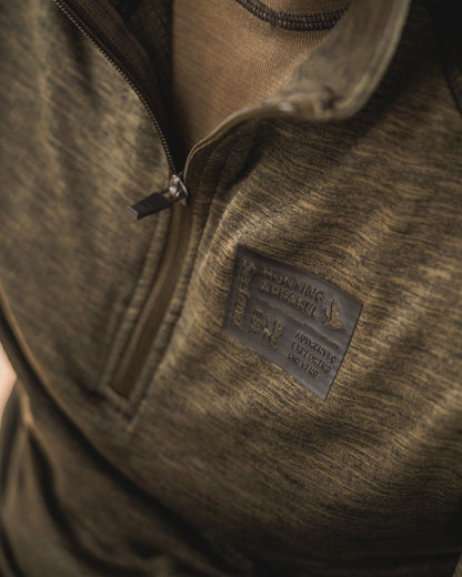 Pine Green Melange Coloured Seeland Peak Half Zip on outdoor background 