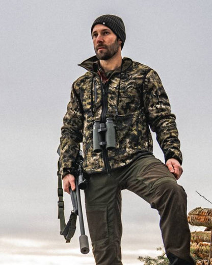 Light Pine InVis Green Coloured Seeland Rogue Reversible Fleece Jacket on sky background 