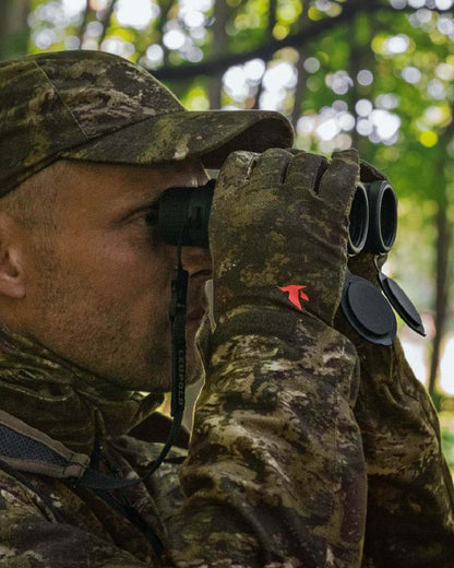 InVis Green Coloured Seeland Scent Control Camo Balaclava on forest background 