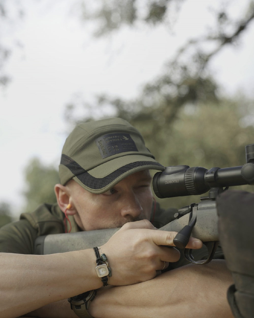 Grape Leaf Coloured Seeland Selous Cap on forest background 