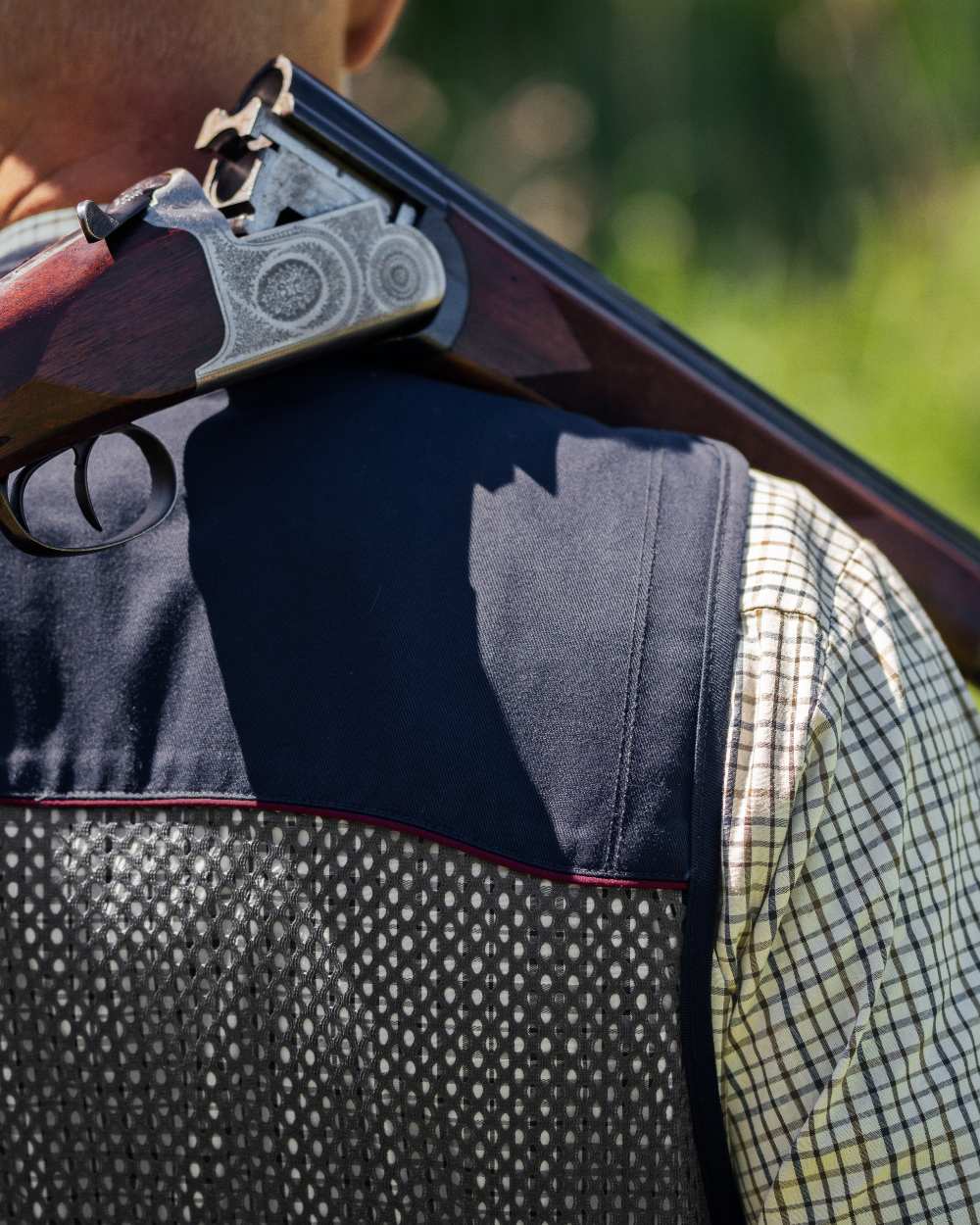 Classic Blue coloured Seeland Skeet II Waistcoat on forest background 