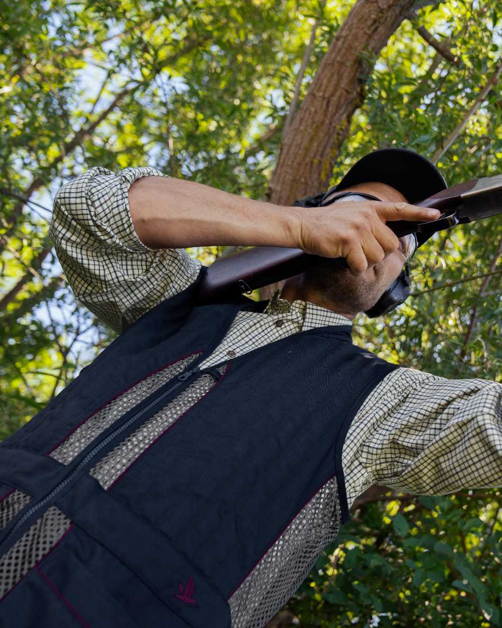 Classic Blue coloured Seeland Skeet II Waistcoat on forest background 