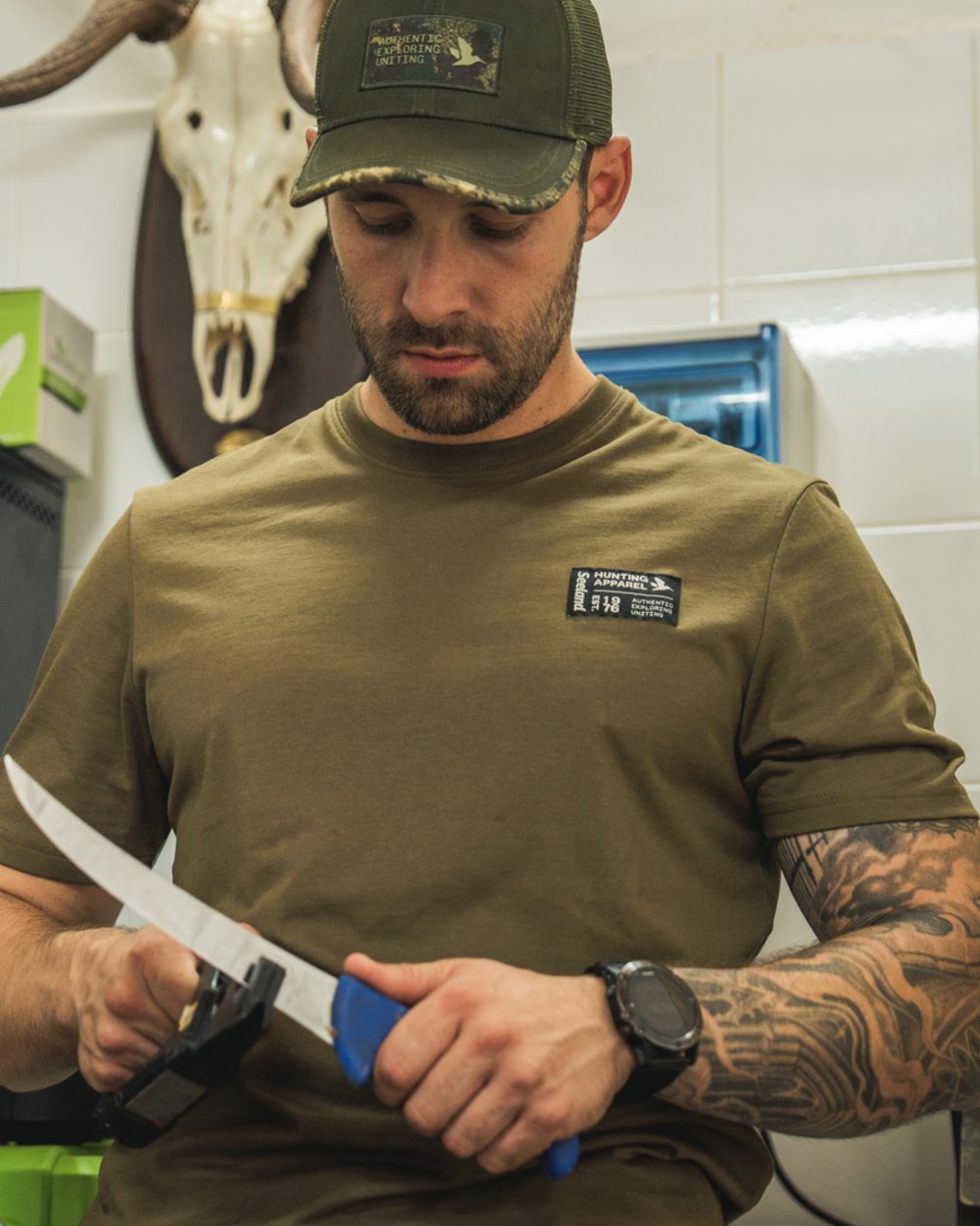Military Olive Coloured Seeland Striker T-Shirt on indoor background 