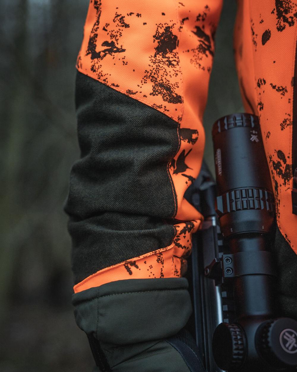 Orange Blaze InVis MPC coloured Seeland Trax Blaze Jacket on forest background 