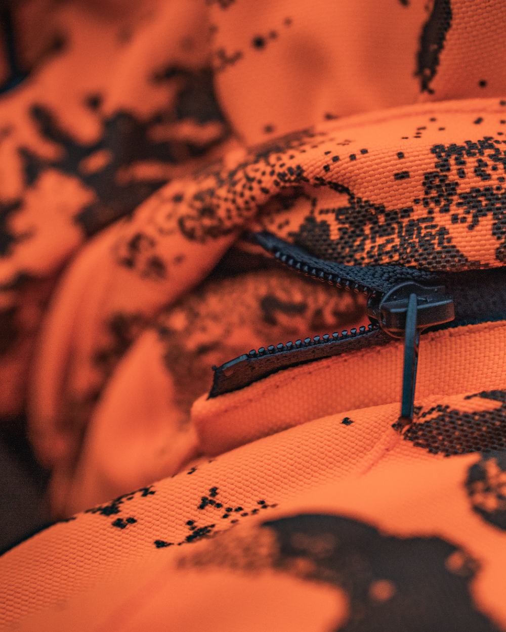 Orange Blaze InVis MPC coloured Seeland Trax Blaze Jacket on forest background 