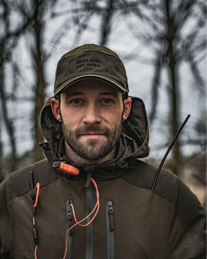 Light Pine Coloured Seeland Trax Cap on forest background 