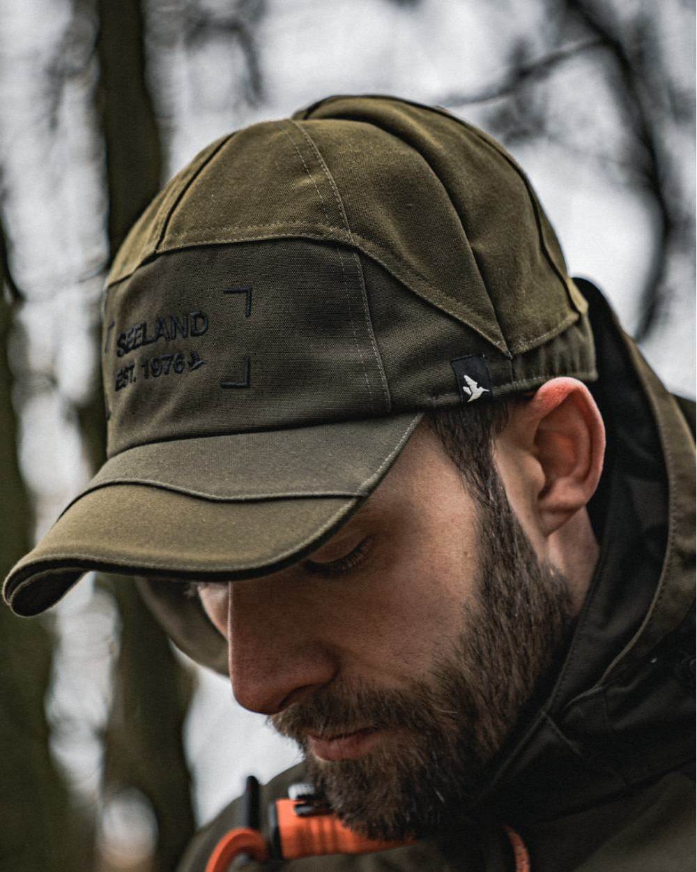Light Pine Coloured Seeland Trax Cap on forest background 