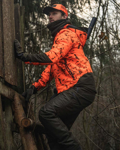Pine Green coloured Seeland Trigger Fold-Back Gloves on forest background 