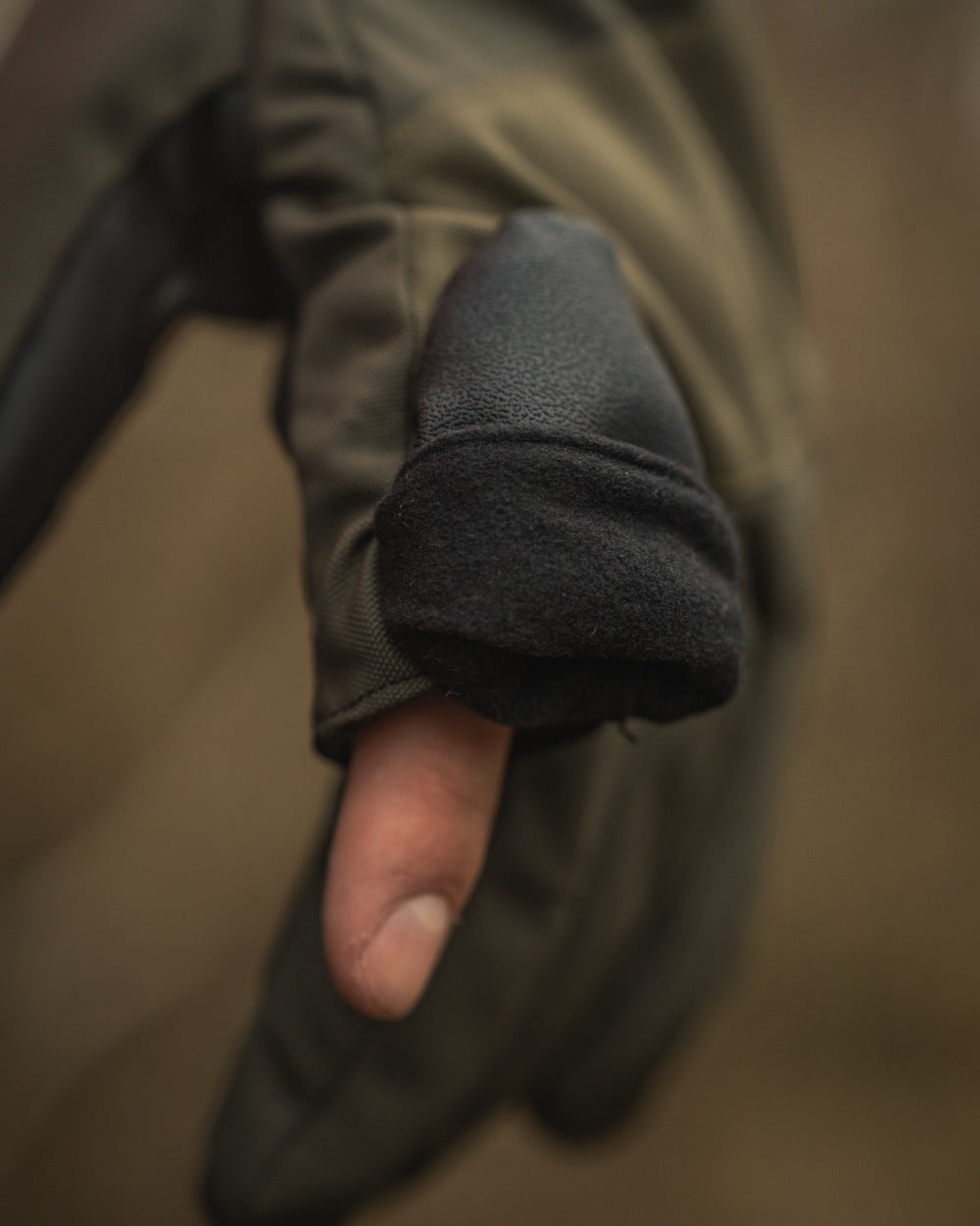 Pine Green coloured Seeland Trigger Fold-Back Gloves on forest background 
