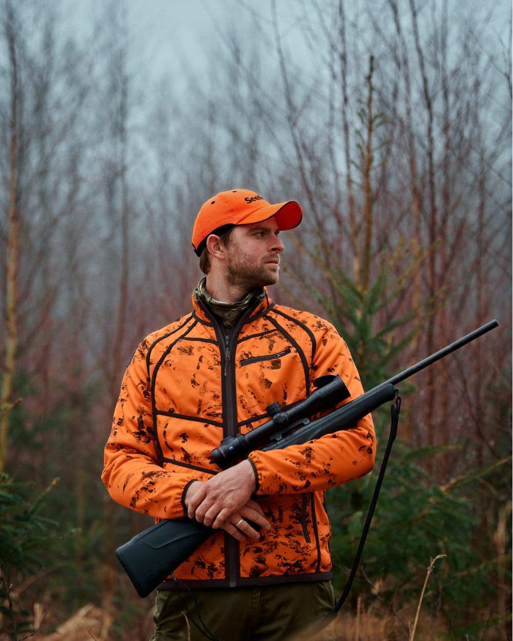 Pine Green InVis Orange Blaze Coloured Seeland Vantage Reversible Fleece Jacket on forest background 