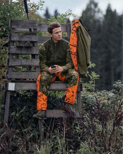 InVis Green InVis Orange Blaze Coloured Seeland Vantage Trousers on forest background 