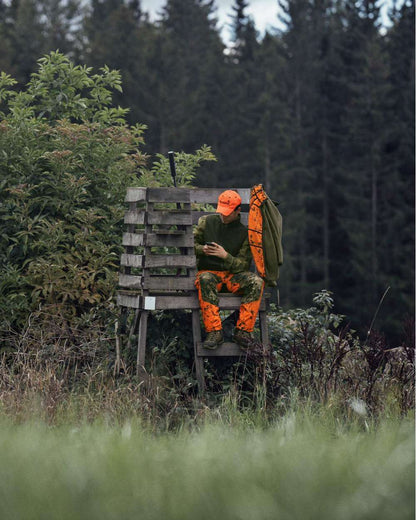 InVis Green InVis Orange Blaze Coloured Seeland Vantage Trousers on forest background 