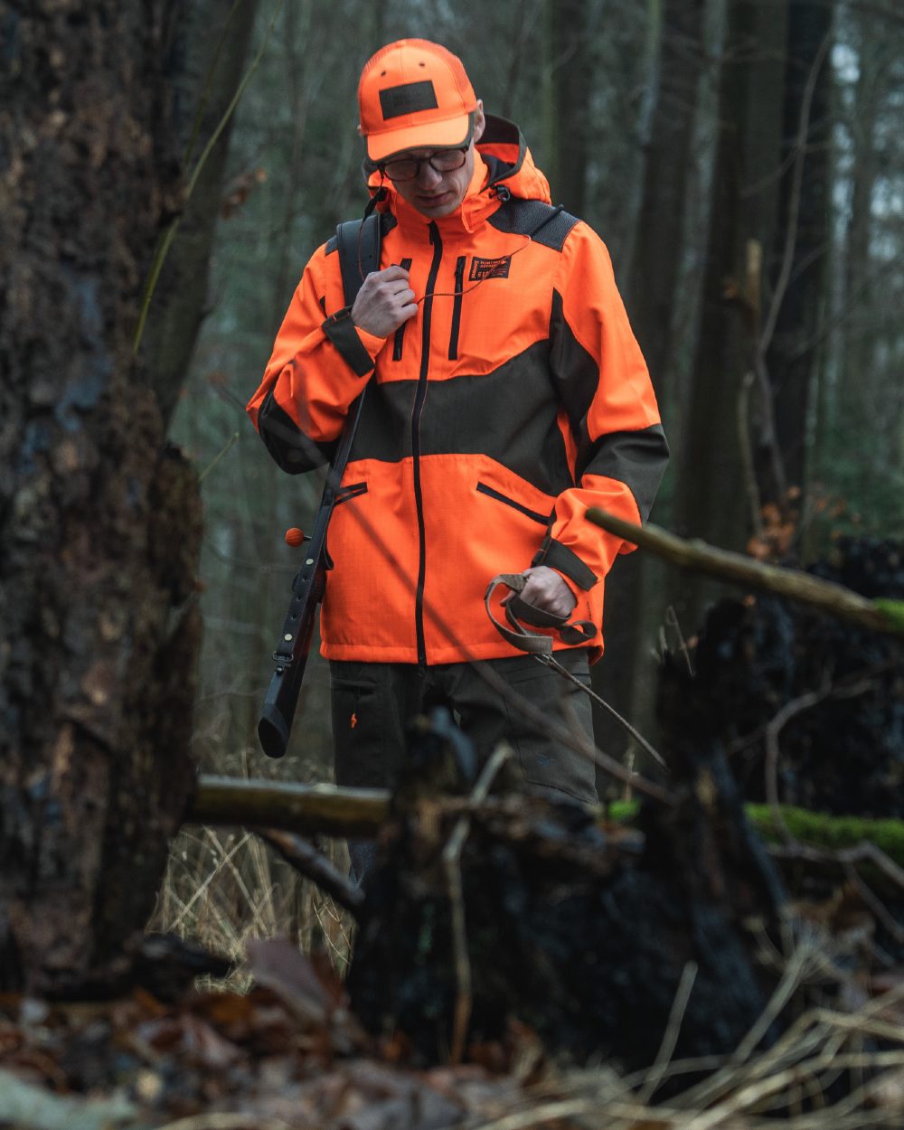 Orange Blaze coloured Seeland Venture Rover Cap on forest background 