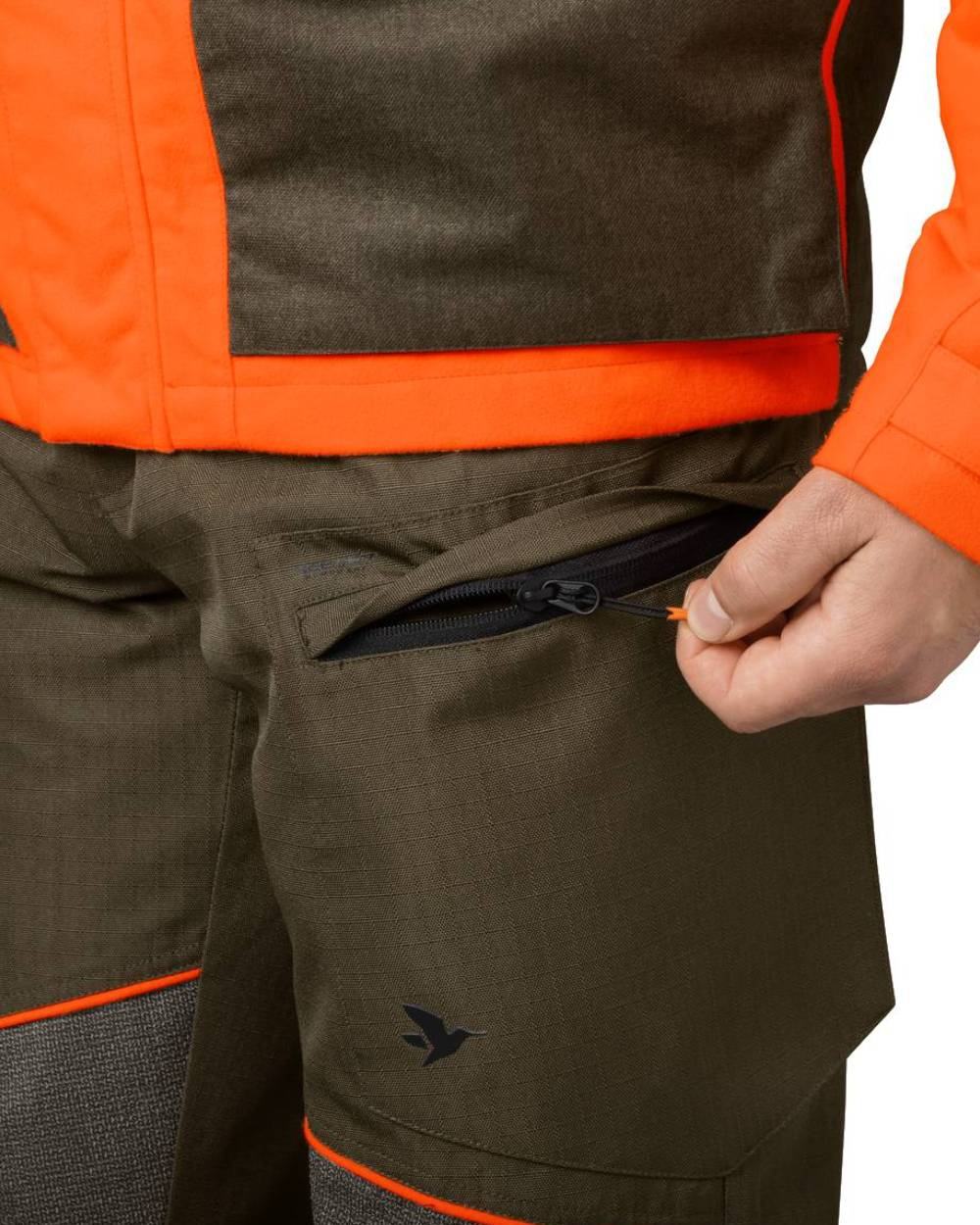 Pine Green Hi-Vis Orange Coloured Seeland Venture Trousers on white background 