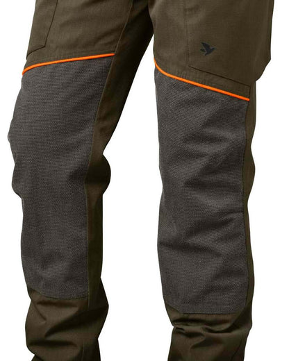 Pine Green Hi-Vis Orange Coloured Seeland Venture Trousers on white background 