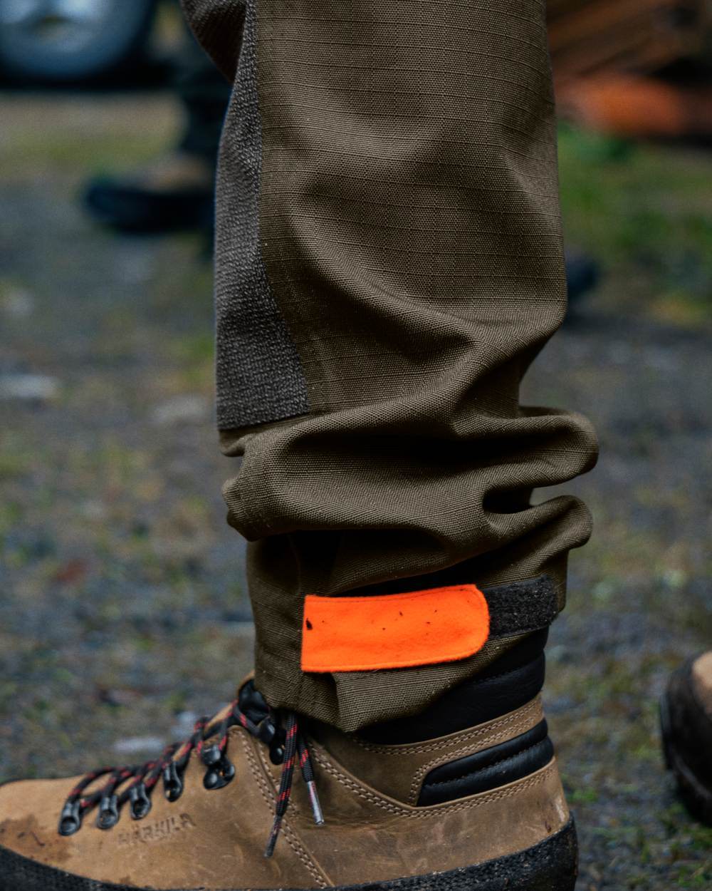 Pine Green Hi-Vis Orange Coloured Seeland Venture Trousers on forest background 