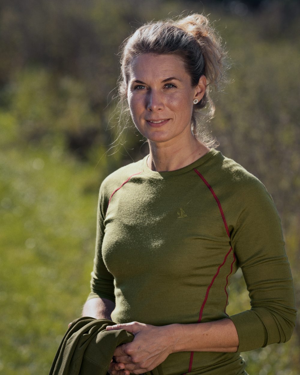 Capulet Olive Coloured Seeland Womens Hawker Base Layer on outdoor background 