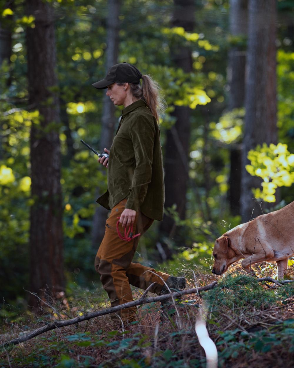 Burnt Clay coloured Seeland Womens Larch Membrane Trousers on forest background 