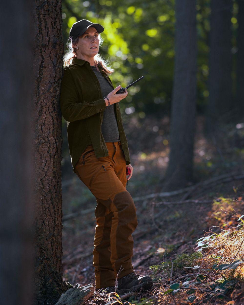 Burnt Clay coloured Seeland Womens Larch Membrane Trousers on forest background 