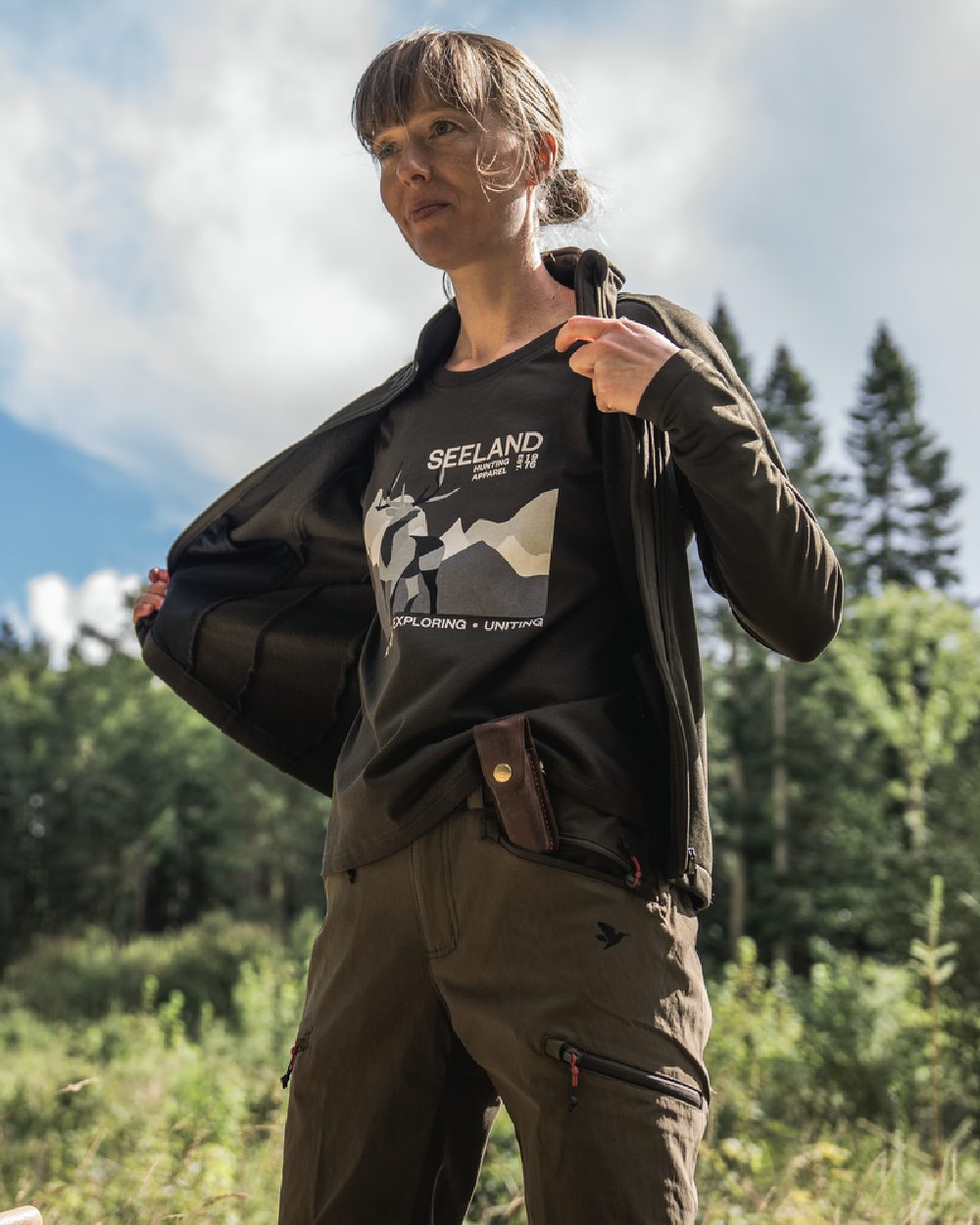 Pine Green Coloured Seeland Womens Sadie T-Shirt on forest background 