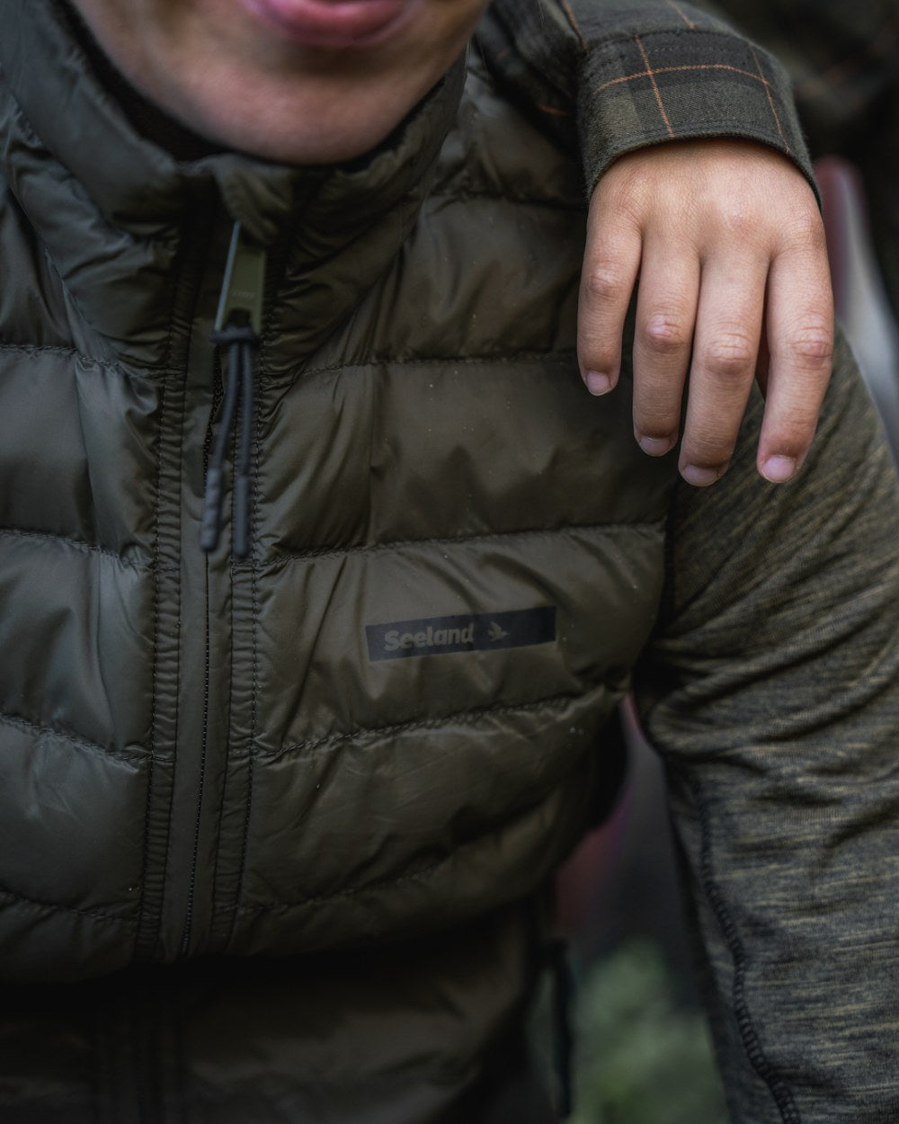 Light Pine Coloured Seeland Womens Therma Waistcoat on forest background 