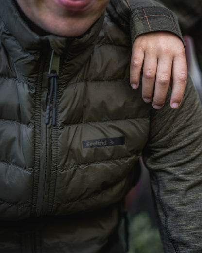 Light Pine Coloured Seeland Womens Therma Waistcoat on forest background 